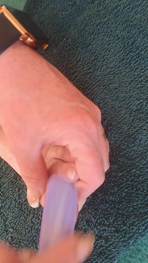 Filing a toenail during a home pedicure. Stock Footage 342323505