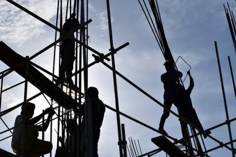 Filipino Construction steel workers assembling steel bars on high-rise building Stock Photos