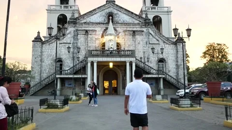 Filipino guy going inside a Historic Church Stock Footage