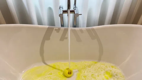 Fill A Bathtub With Yellow Bubble Bath B... | Stock Video | Pond5