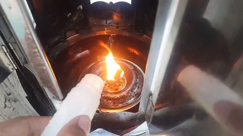 Fill the oil lamp located in the temple. Stock Footage 121069475