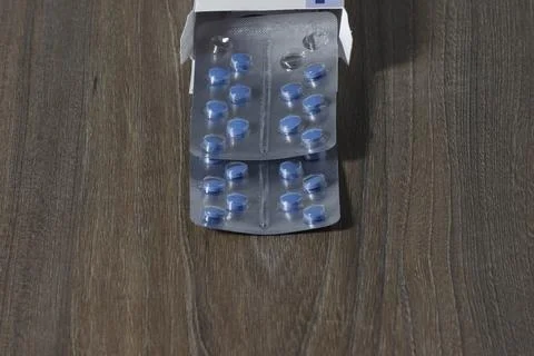 Filled blisters with tablets, partially packed. Stock Photos