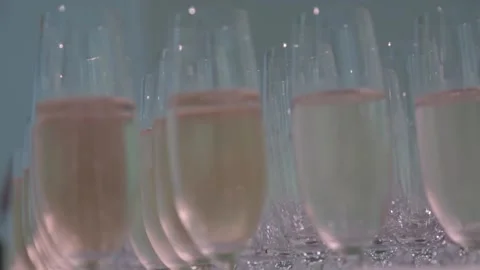 Filled champagne glasses background Stock Footage 145660761