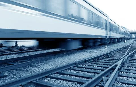 Filled with goods train, high-speed driving. Stock Photos