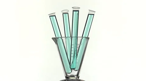 Filled test tubes with blue liquid on a turntable Video stock 64287666