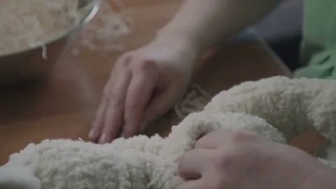 Filler for soft toys. The process of creating a soft handmade toy Stock Footage