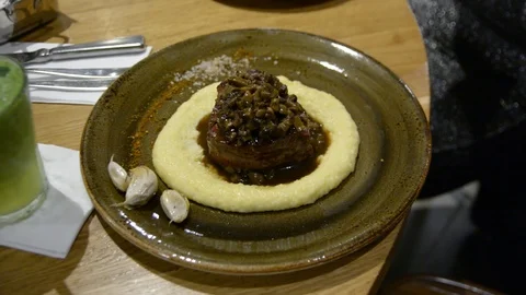 Fillet of beef with mushrooms and mashed potatoes in a restaurant  Stock Footage 101713093