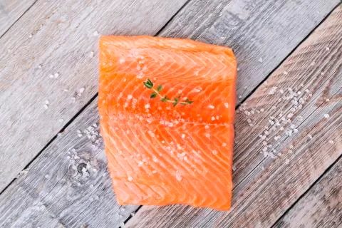 Fillet of fresh salmon with a sprig of thyme Stock Photos