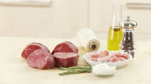 Fillet mignon, rashers of bacon, kitchen twine and spices Stock Footage 24635946