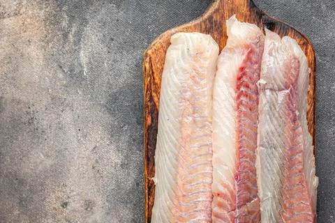 Fillet raw white fish cod or halibut fresh meal food snack on the table cop.. Stock Photos