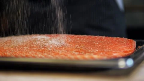 Fillet of red fish, large piece. sprinkle a large piece of fish with salt. Stock Footage 158241329