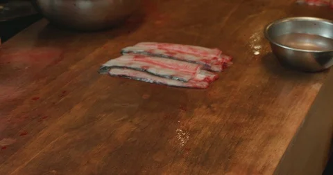 Filleted and butterflied eels on a table Video stock 107824269