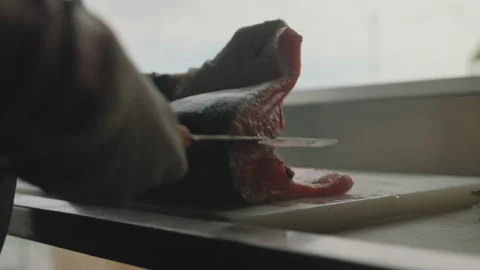 Filleting a fish on counter Stock Footage 275070104