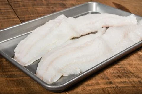 Fillets of cod fish on baking pan Foto stock