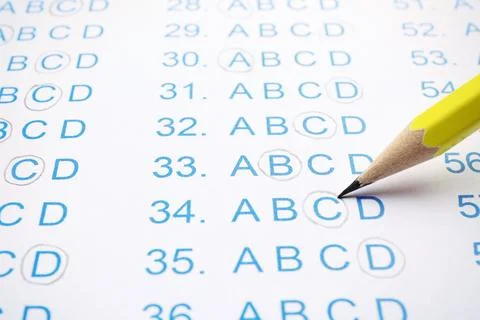 Filling answer sheet with pencil, closeup view Stock Photos
