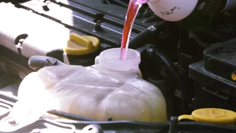 Filling antifreeze in the engine cooling system. Video stock 138687403