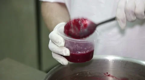 Filling of Berry Jam in Plastic Jars. Stock Footage 60097719