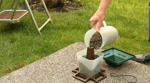 Filling a Bird Feeder Stock Footage 11518799