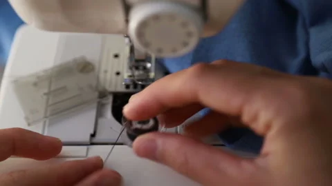 Filling bobbin with thread in the sewing machine. Stock Footage 115701324