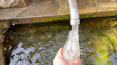 Filling the bottle with pure drinking water Stock Footage 254125061