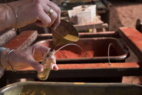 Filling bottle of sand Stock Photos