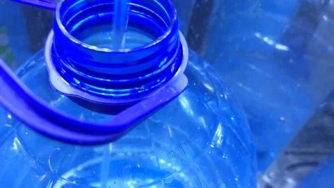 Filling the bottle with water Stock Footage 205609998
