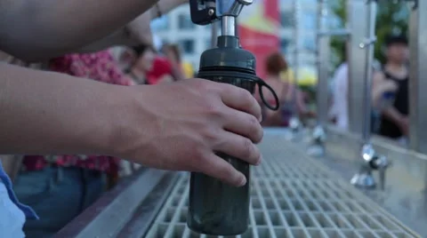 Filling up bottles with drinking water Stock Footage 51891327