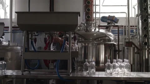 Filling bottles with liquid Stock Footage 137675100