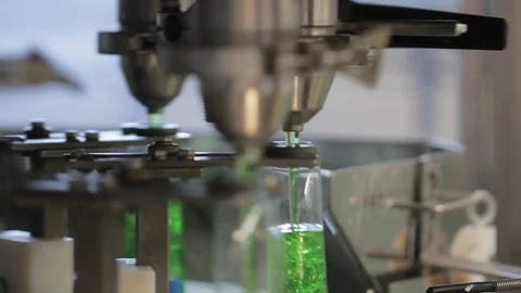 Filling bottles on production line Stock Footage 77267891