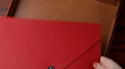 Filling a briefcase Stock Footage 22606117