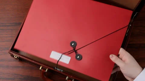 Filling a briefcase Stock Footage 22606809