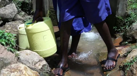 Filling buckets at spring super slow motion Video stock 47121775