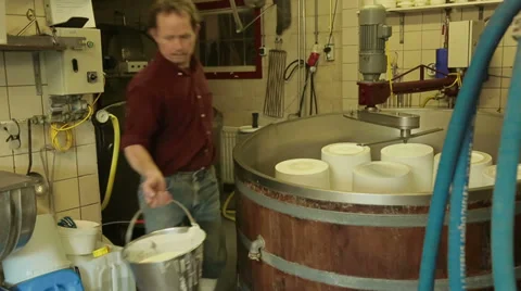 Filling buckets with Yoghurt Stock Footage 35331490