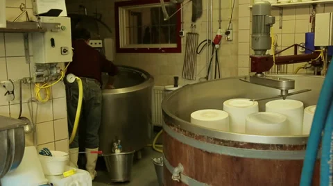 Filling buckets with Yogurt Stock Footage 35331476