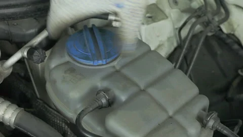 Filling the car with antifreeze. Stock-Footage 97304191