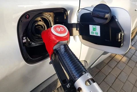 Filling the car with gasoline. The process of refueling the car with fuel Stock Photos