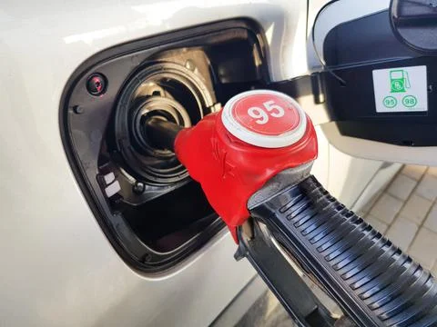 Filling the car with gasoline. The process of refueling the car with fuel Stock Photos
