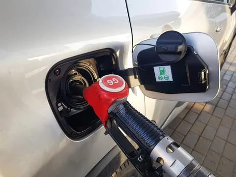 Filling the car with gasoline. The process of refueling the car with fuel Stock Photos