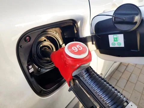 Filling the car with gasoline. The process of refueling the car with fuel Stock Photos