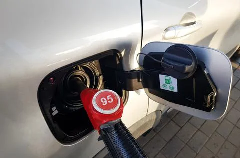 Filling the car with gasoline. The process of refueling the car with fuel Stock Photos