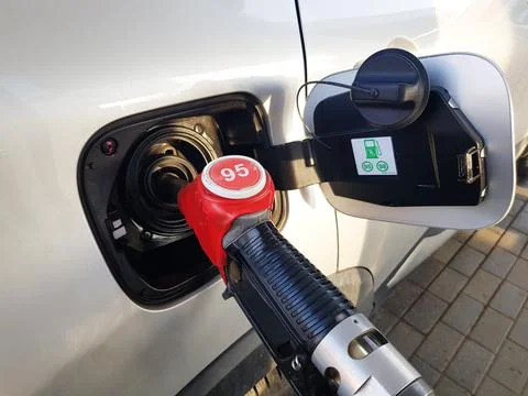 Filling the car with gasoline. The process of refueling the car with fuel Stock Photos