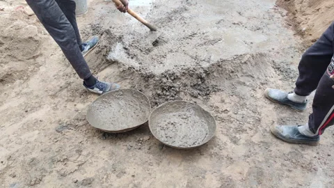 Filling cement mix into tray Stock-Footage 256977148