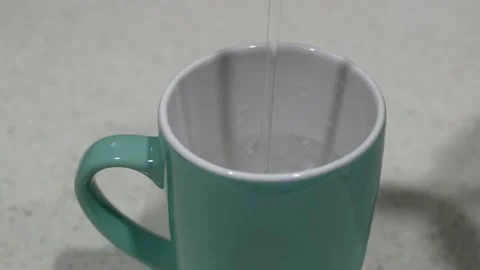 Filling up a ceramic cup with clean drinking water 動画素材 143011437