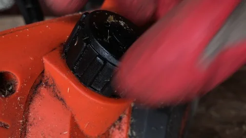 Filling A Chainsaw With Chain Oil 스톡 동영상 102240487