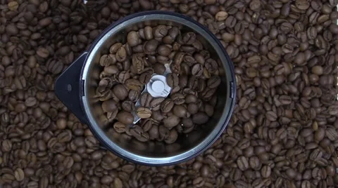 Filling a coffee grinder with coffee beans Video stock 46021556
