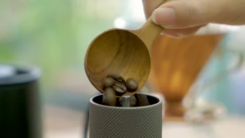 Filling the coffee grinder with coffee beans Stock Footage 148162344