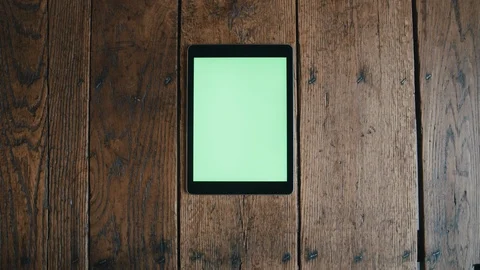 Filling coffee mug next to tablet on wood table Stock-Footage 97747028