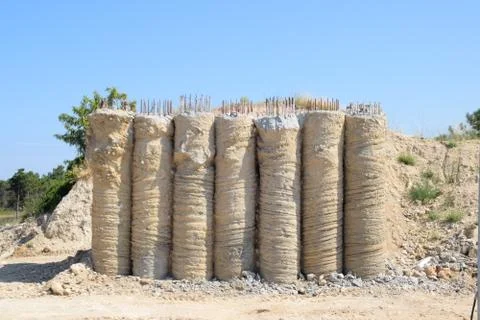 Filling the columns of the future bridge. Construction of transport interchan Stock Photos