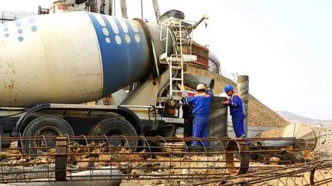 Filling concrete with casing mixer and well after concrete drilling Stock Footage 74006156