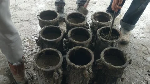 Filling concrete cylinders Stock Footage 310032553